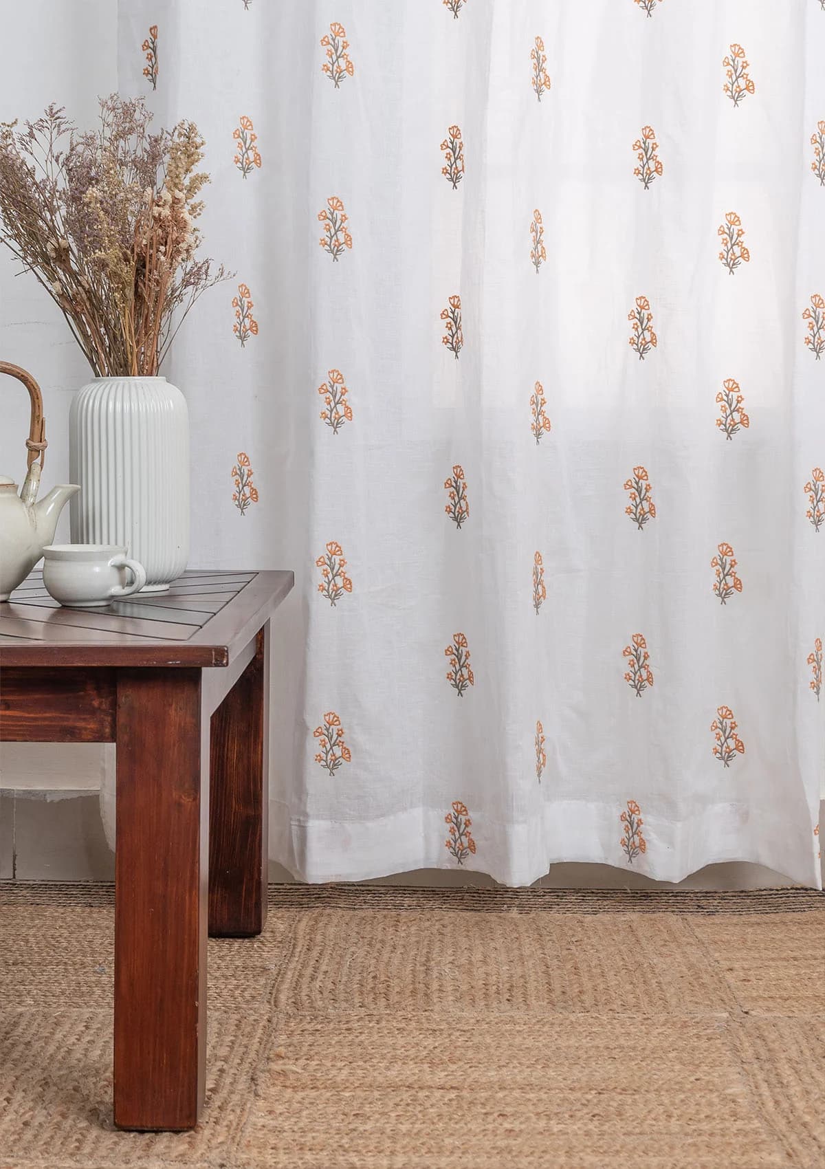 White cotton sheer curtain with embroidered orange floral motifs