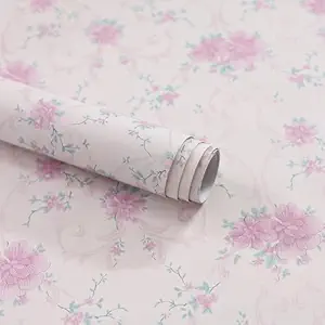 Soft pink blossom floral wallpaper on a pale background
